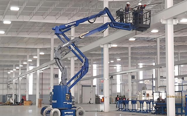 Access equipment working inside the plant.